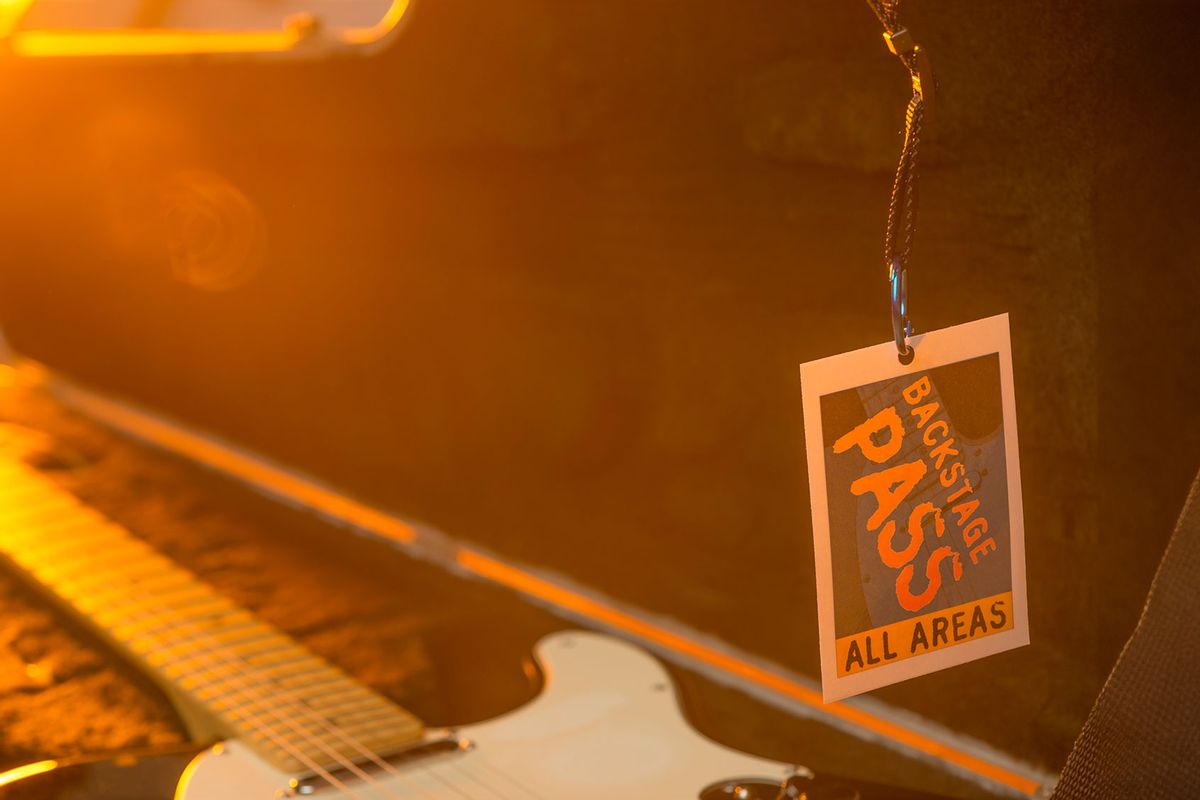 Backstage pass with guitar (Getty Images/courtneyk)